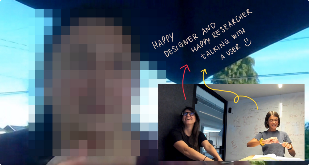 Happy designer and researcher talking with a user